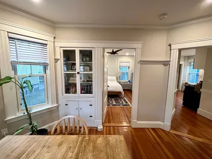 a view of a living room and hardwood floor
