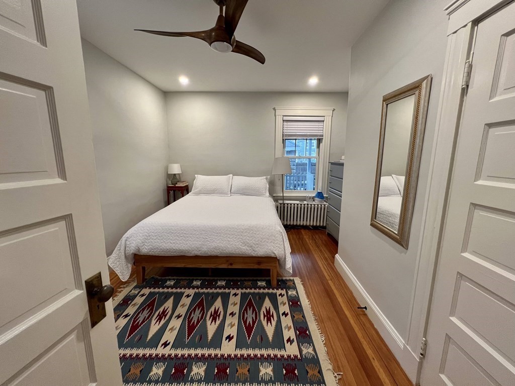 12 Rosemary Street, Unit 1 Boston, MA 02130 - Photo 8 of 17 a bedroom with furniture and a window