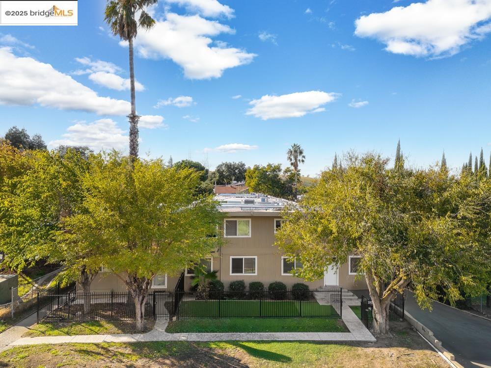 3126 Lone Tree Way Antioch, CA 94509 - Photo 21 of 24 View of property hidden behind natural elements featuring a fenced front yard