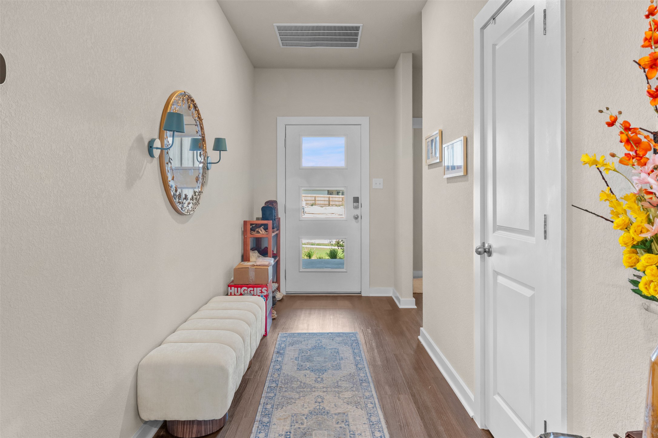 236 Lazy Lizzy Road Jarrell, TX 76537 - Photo 5 of 27 A welcoming entryway with rich wood flooring invites you into this home.
