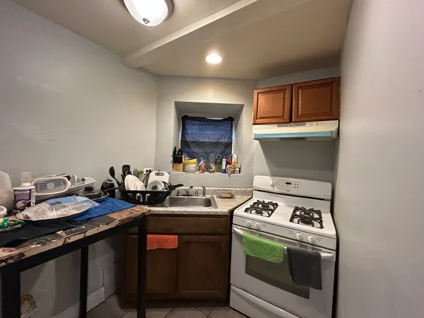 a kitchen with a stove and a sink