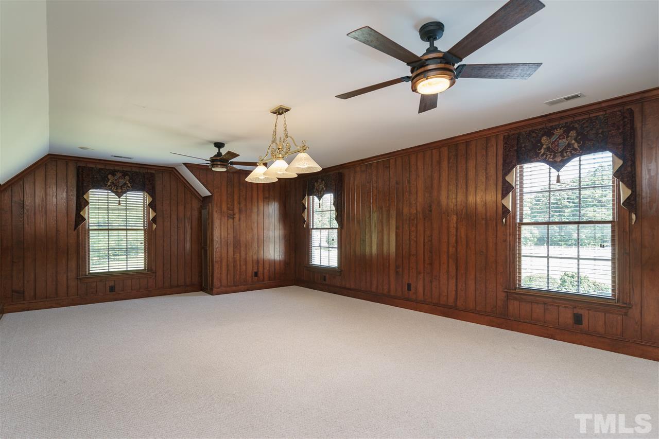8446 Seven Paths Road Spring Hope, NC 27882 - Photo 12 of 24 a view of a livingroom with a ceiling fan and window