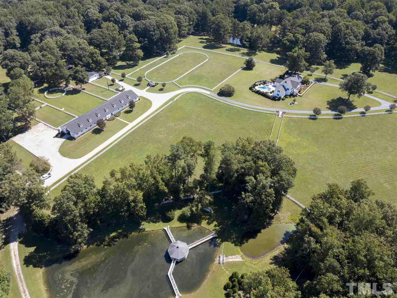 8446 Seven Paths Road Spring Hope, NC 27882 - Photo 15 of 24 an aerial view of a house with a swimming pool