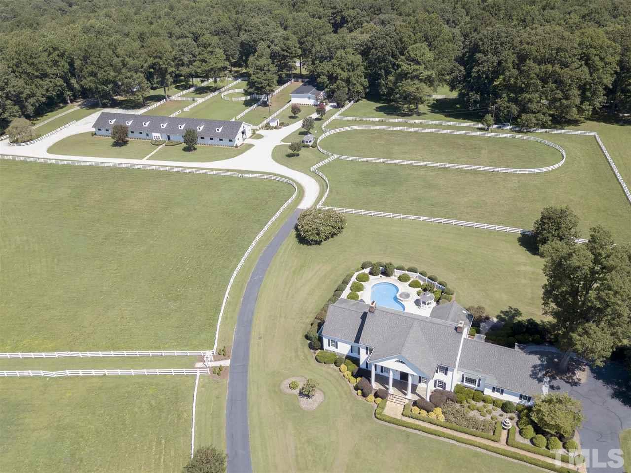 8446 Seven Paths Road Spring Hope, NC 27882 - Photo 18 of 24 a view of a swimming pool with a yard