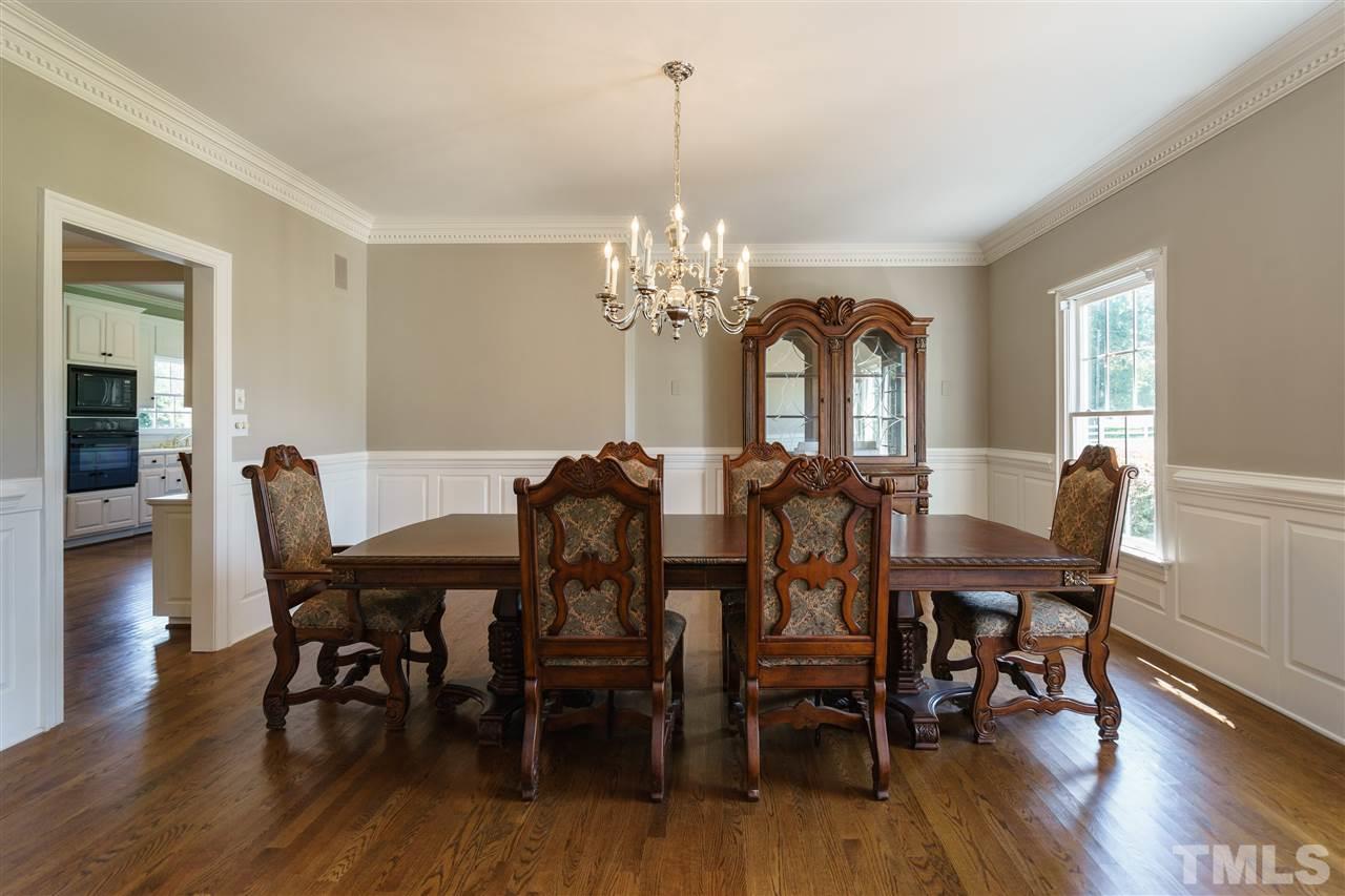 8446 Seven Paths Road Spring Hope, NC 27882 - Photo 3 of 24 a view of a dining room with furniture window and wooden floor