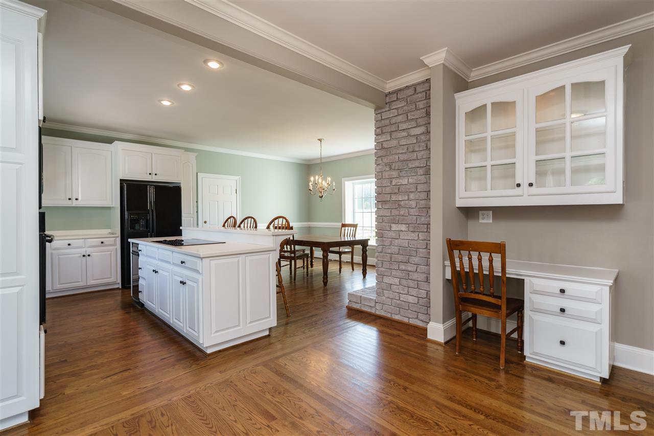 8446 Seven Paths Road Spring Hope, NC 27882 - Photo 6 of 24 a large white kitchen with a large window