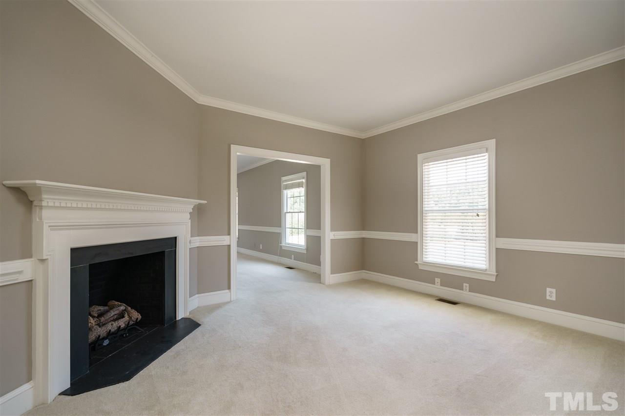 8446 Seven Paths Road Spring Hope, NC 27882 - Photo 8 of 24 a view of a livingroom with a fireplace and window