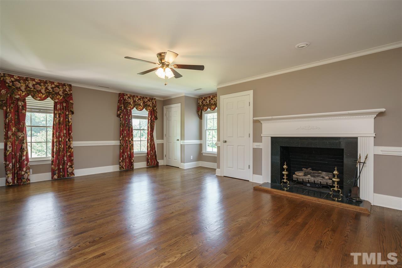 8446 Seven Paths Road Spring Hope, NC 27882 - Photo 10 of 24 a view of an empty room with a fireplace and window