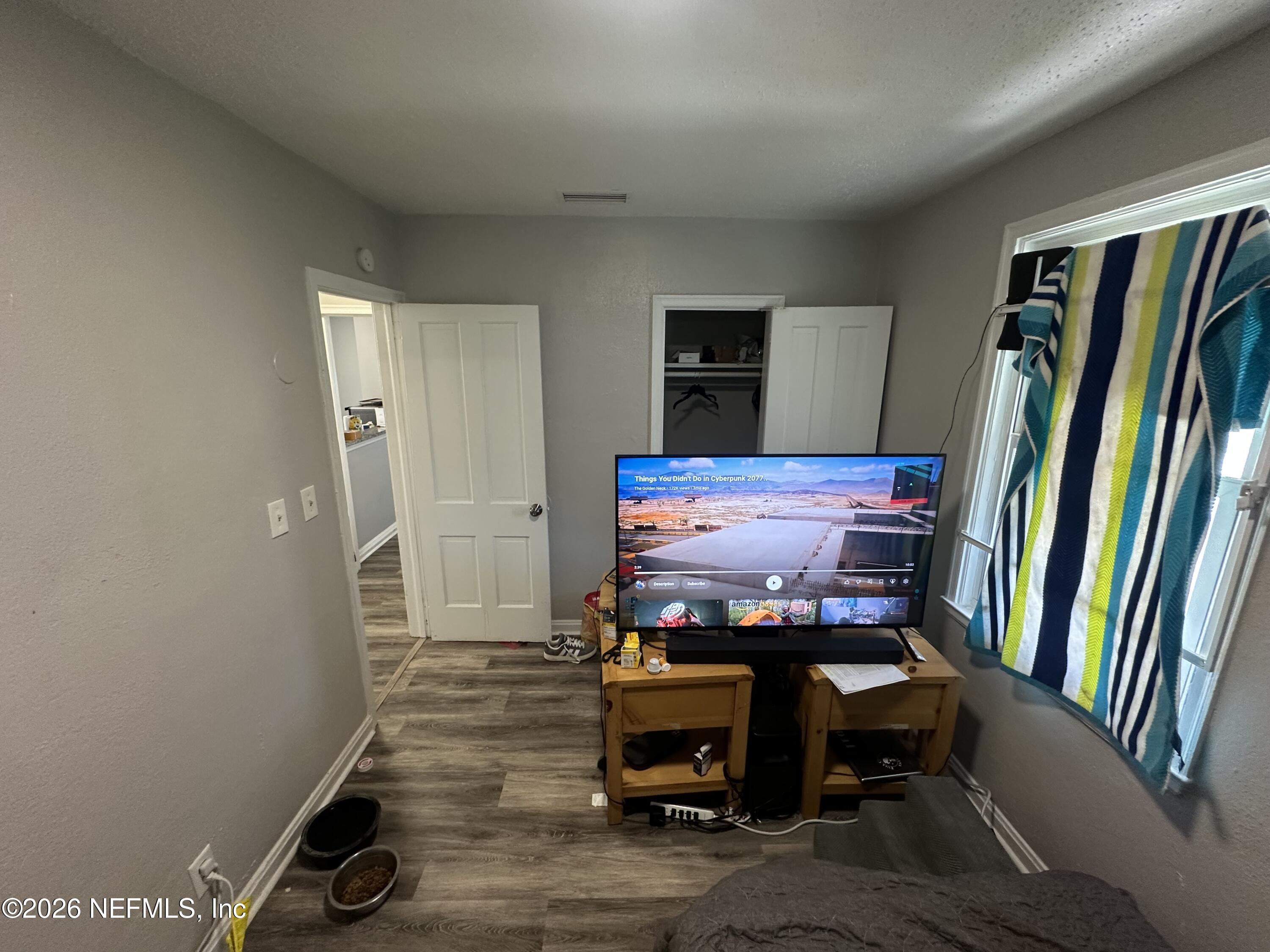 1804 Cleveland Street Jacksonville, FL 32209 - Photo 11 of 14 a room with furniture and a flat screen tv