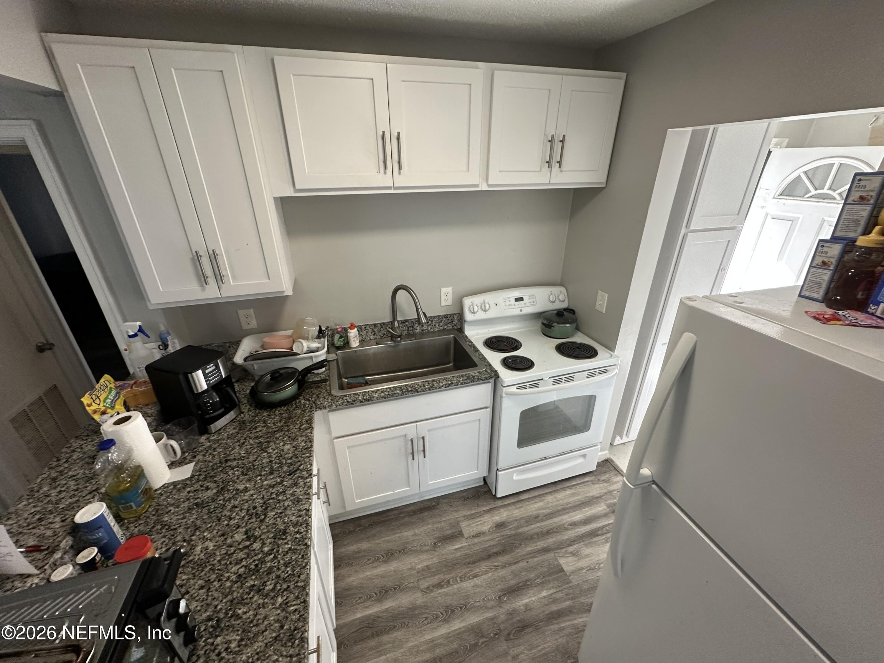 1804 Cleveland Street Jacksonville, FL 32209 - Photo 8 of 14 a kitchen with sink and cabinets