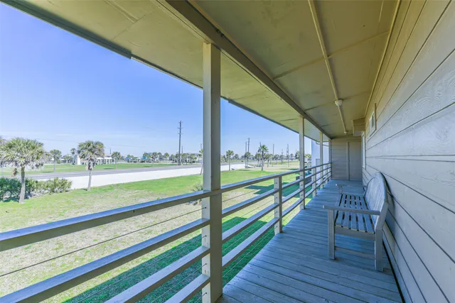 a view of swimming pool with balcony