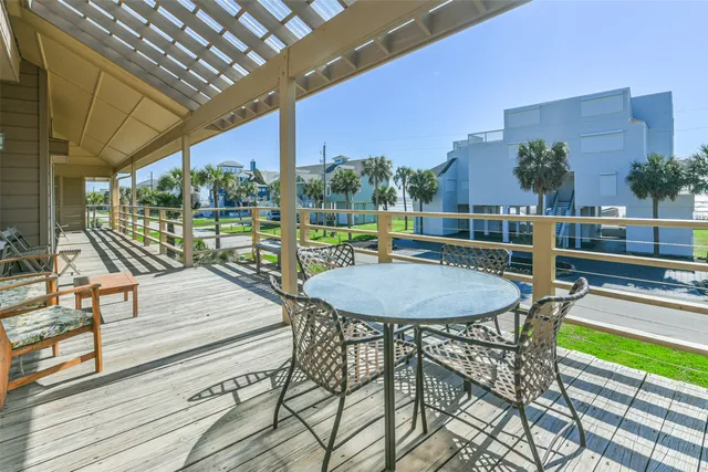 a living room with fireplace furniture and a large window