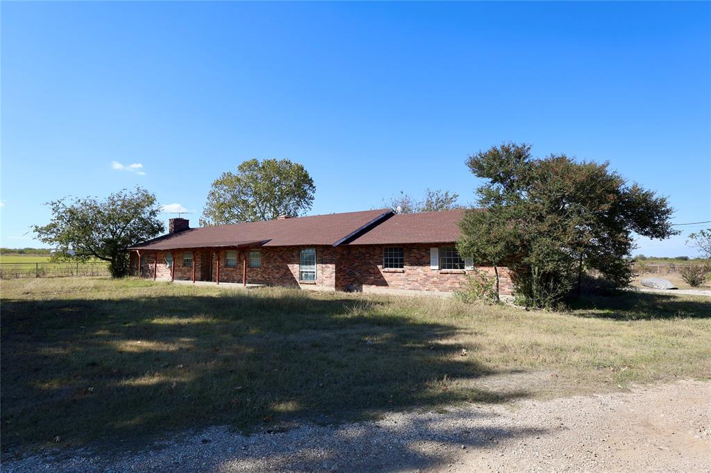 1600 County Road 1109A Rio Vista, TX 76093 - Photo 24 of 29 a front view of a house with a yard