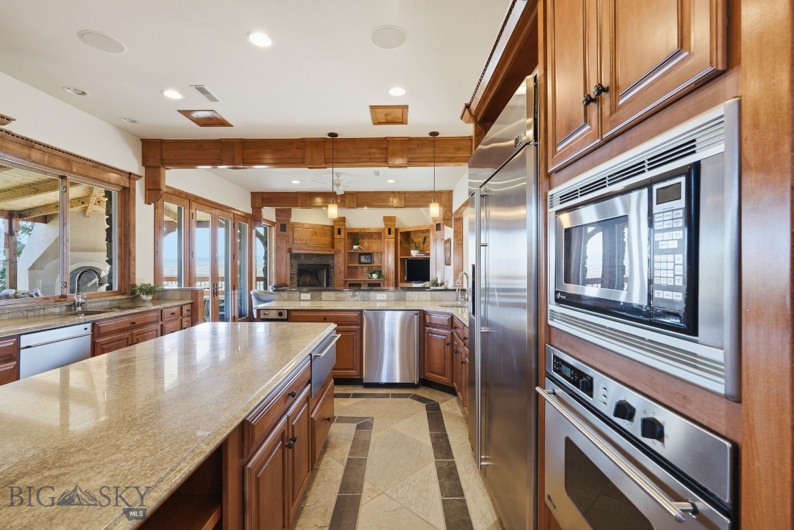 1240 Twin River Cutoff Road Manhattan, MT 59741 - Photo 13 of 88 Spacious kitchen with built-in wall oven, food warmer, microwave and beverage fridge