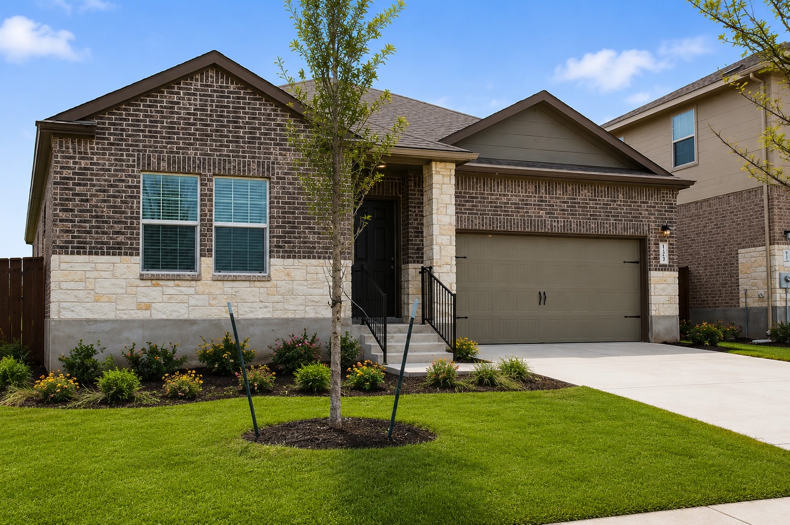 828 Mallow Road Leander, TX 78641 - Photo 2 of 14 A well-maintained lawn and tasteful landscaping introduce this charming brick and stone residence.
