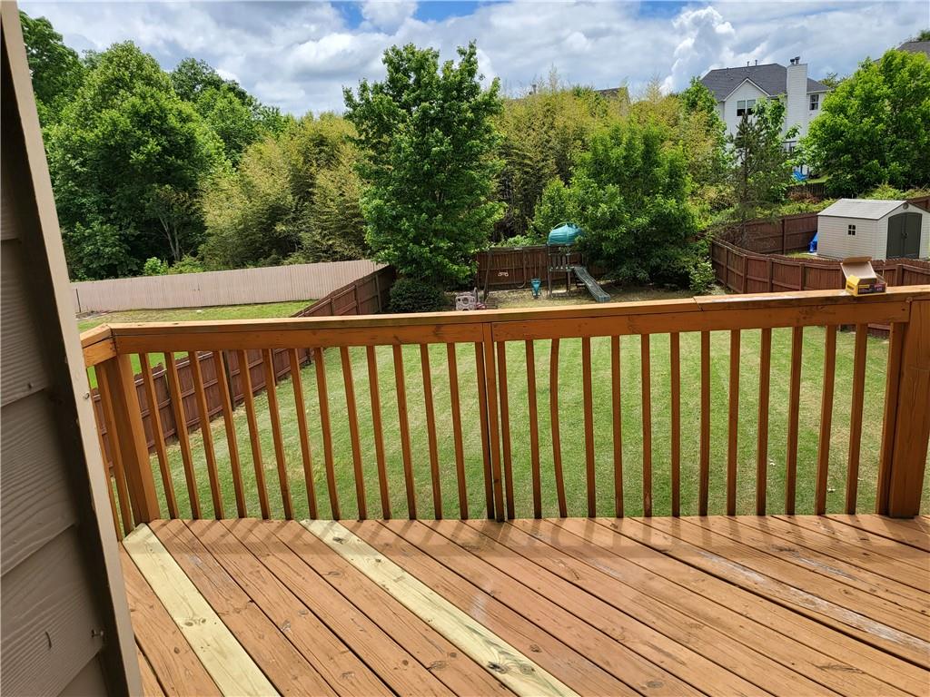 950 Rockbass Road Suwanee, GA 30024 - Photo 14 of 33 a view of balcony with wooden floor
