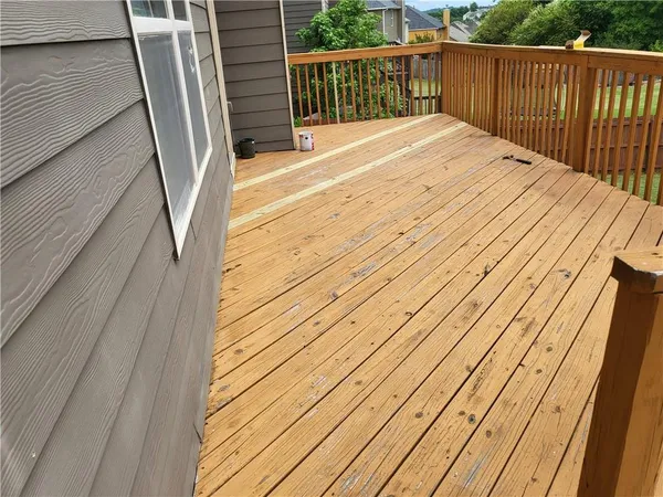 a balcony with wooden floor
