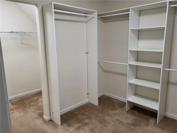 a view of an empty walk in closet