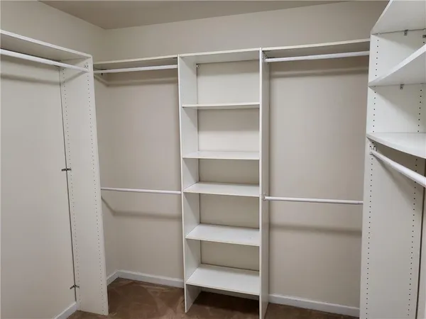 a view of an empty walk in closet