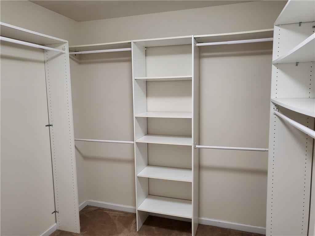 950 Rockbass Road Suwanee, GA 30024 - Photo 22 of 33 a view of an empty walk in closet