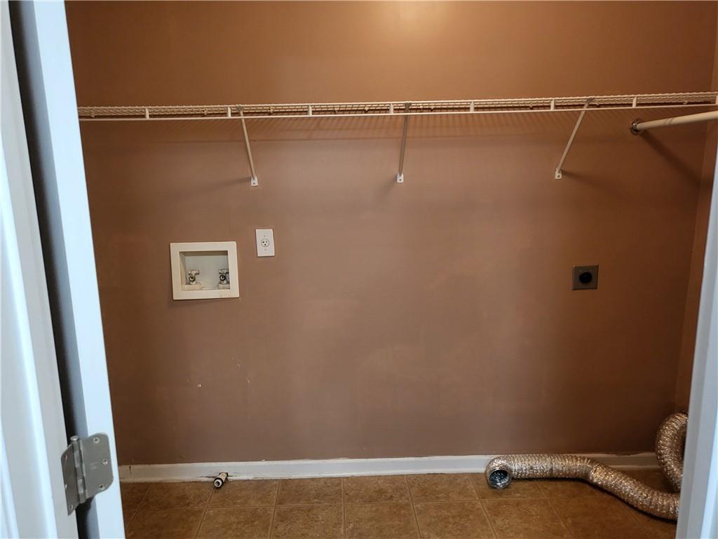 950 Rockbass Road Suwanee, GA 30024 - Photo 33 of 33 a view of a room with racks on the wall