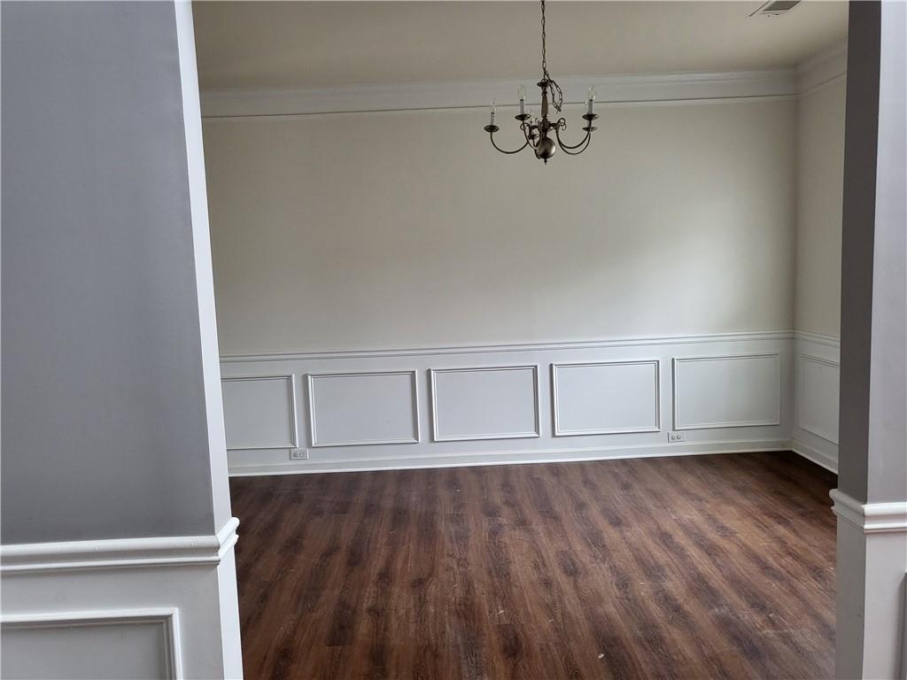 950 Rockbass Road Suwanee, GA 30024 - Photo 4 of 33 a view of room with wooden floor