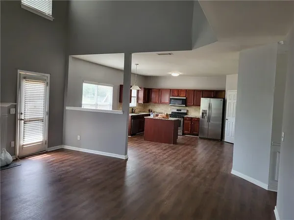 a view of kitchen with wooden floor