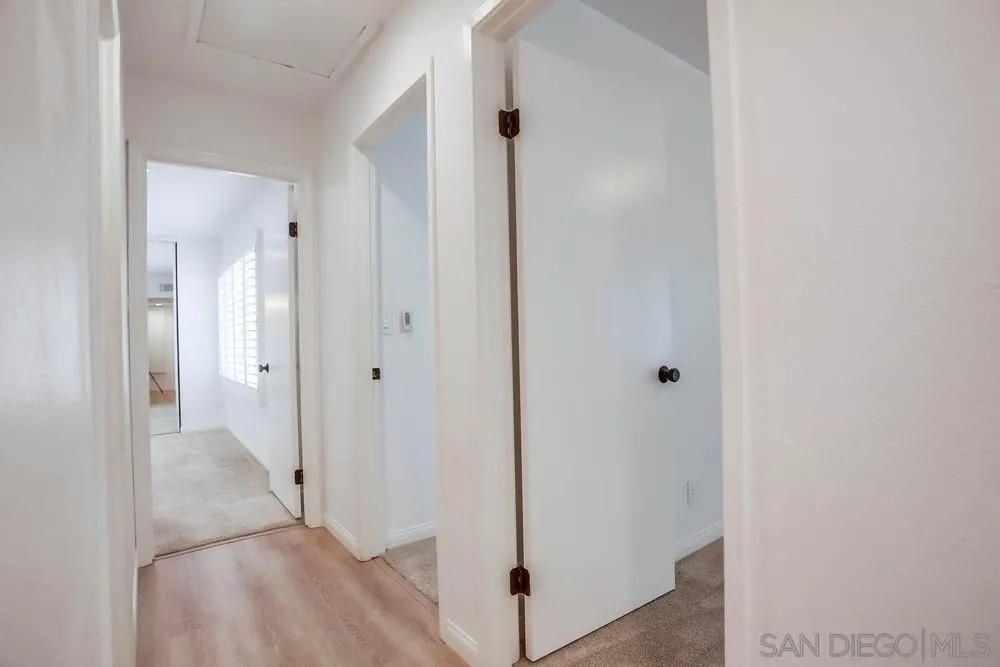 1228 Evergreen Drive Cardiff, CA 92007 - Photo 17 of 37 a view of a hallway with wooden floor