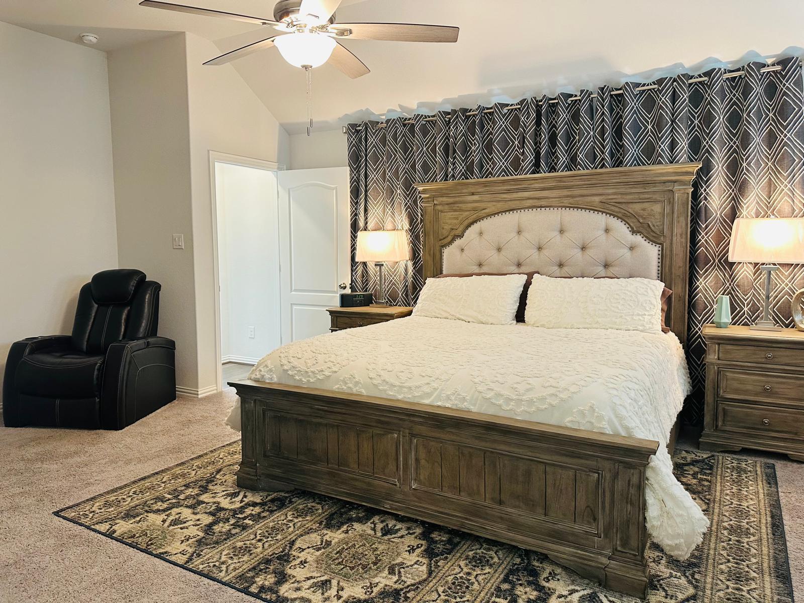 862 Leadtree Loop Buda, TX 78610 - Photo 20 of 40 a bedroom with a bed and a mirror