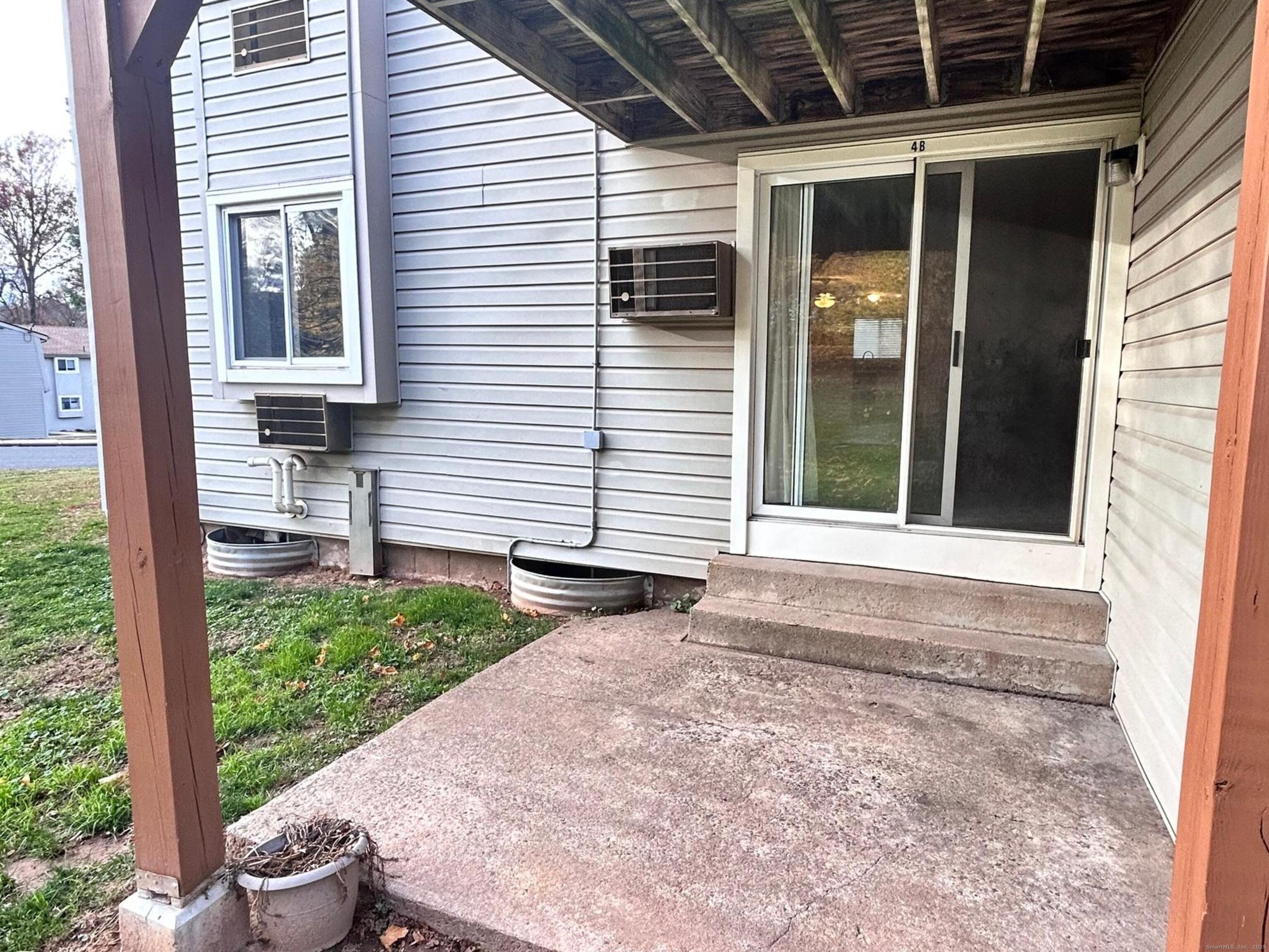 4 Carillon Drive, Unit B Rocky Hill, CT 06067 - Photo 15 of 16 a front view of a house with garden