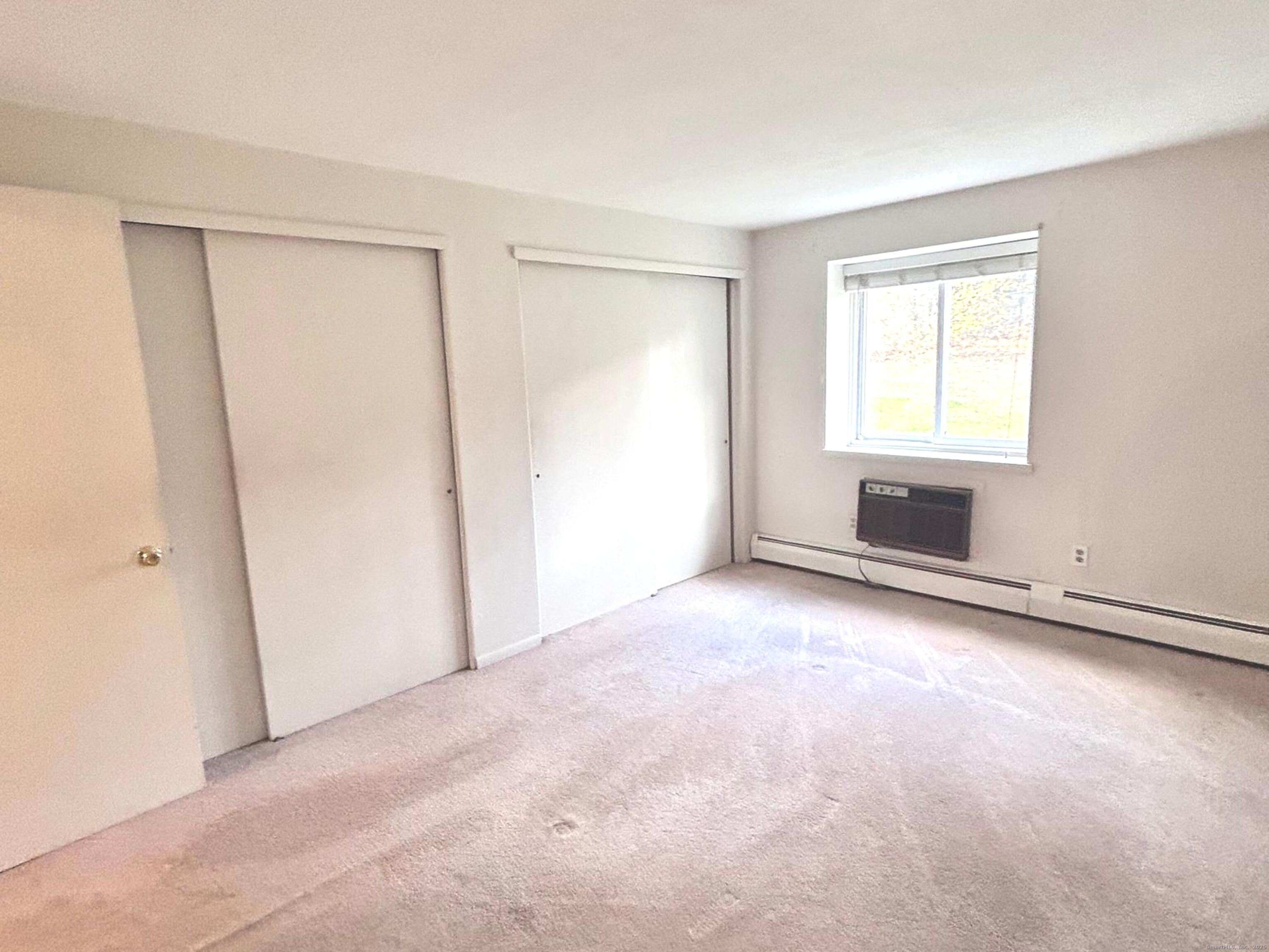4 Carillon Drive, Unit B Rocky Hill, CT 06067 - Photo 10 of 16 a view of an empty room with a window
