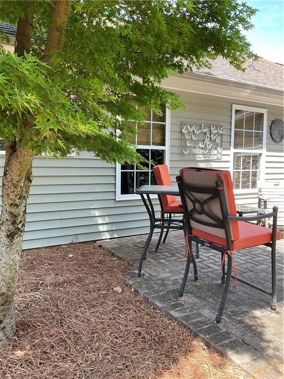 5403 Stone Trace Gainesville, GA 30504 - Photo 101 of 126 a view of a chairs and table in the back yard of the house