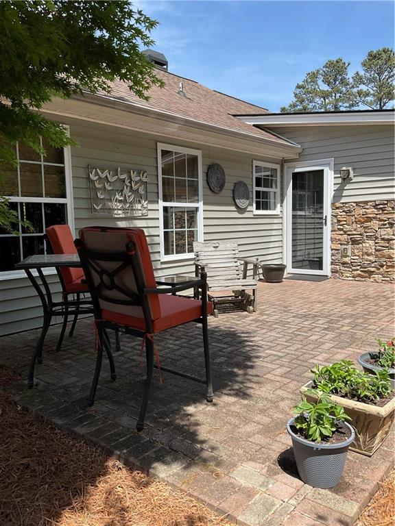 5403 Stone Trace Gainesville, GA 30504 - Photo 102 of 126 a view of a house with backyard and sitting area