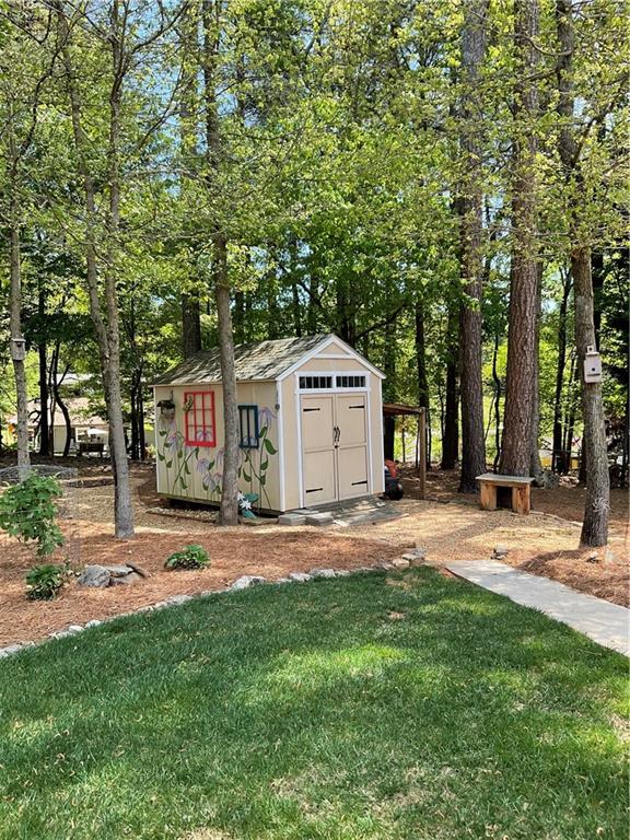 5403 Stone Trace Gainesville, GA 30504 - Photo 104 of 126 a front view of a house with a yard and garage