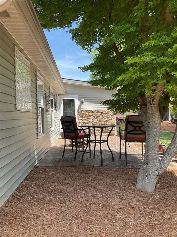 5403 Stone Trace Gainesville, GA 30504 - Photo 124 of 126 a view of a tables and chairs in a patio