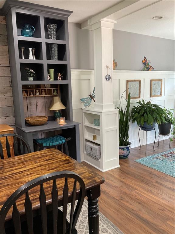 5403 Stone Trace Gainesville, GA 30504 - Photo 28 of 126 a bedroom with a bed and a bookshelf with wooden floor