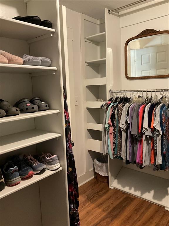5403 Stone Trace Gainesville, GA 30504 - Photo 61 of 126 a view of walk in closet with clothes and shoes