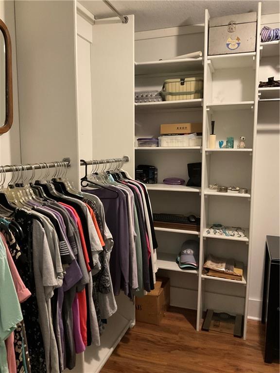 5403 Stone Trace Gainesville, GA 30504 - Photo 63 of 126 a view of walk in closet with clothes and shoes