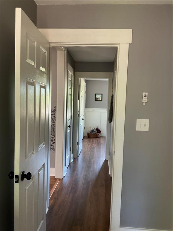 5403 Stone Trace Gainesville, GA 30504 - Photo 89 of 126 a view of a hallway with wooden floor and a living room