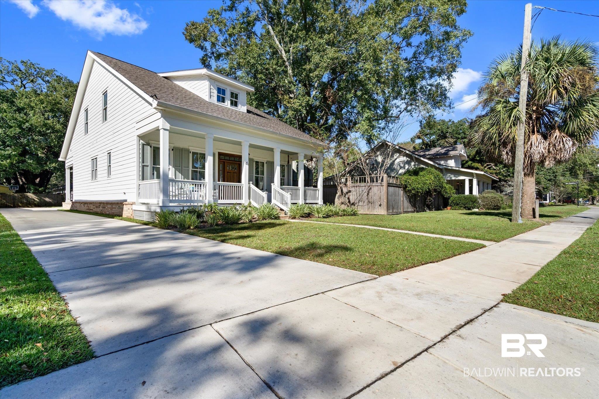 15 Semmes Avenue Mobile, AL 36604 - Photo 27 of 43 View of front of home featuring a porch and a front lawn