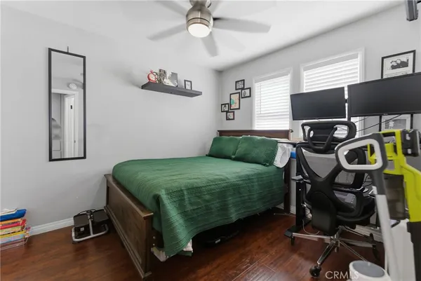 a bedroom with furniture and a window