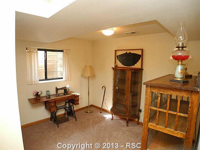 742 Rundle Court Colorado Springs, CO 80911 - Photo 14 of 19 The forth bedroom in the basement. Carpeted floors in the basement.