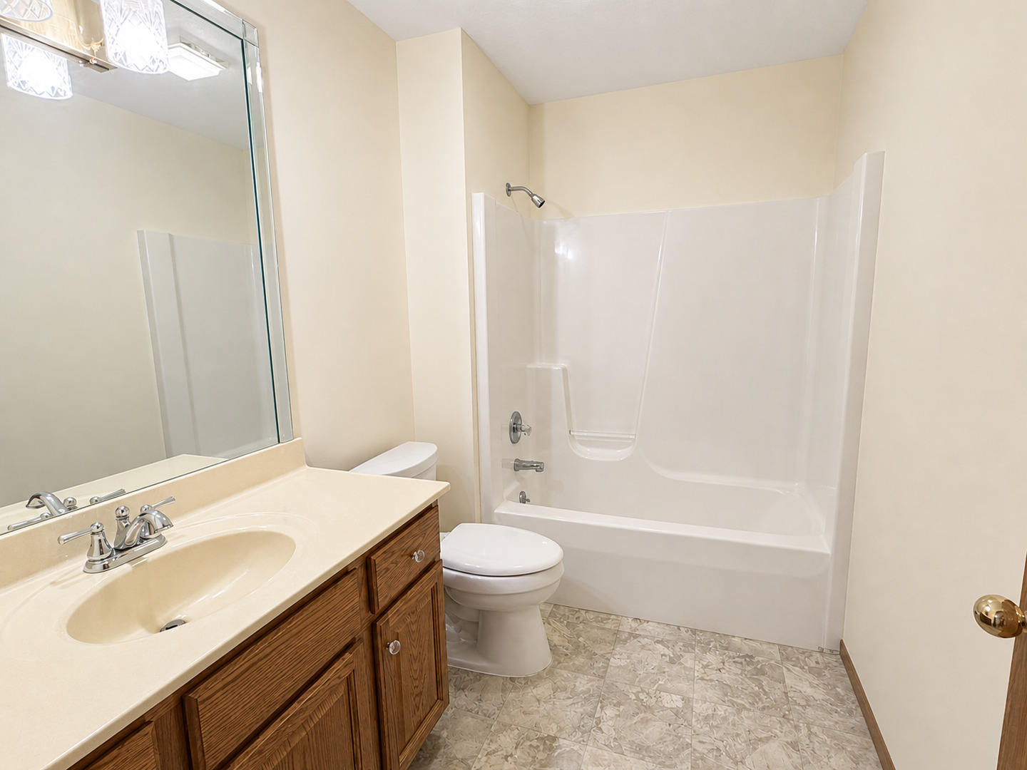 2608 38th Street Moline, IL 61265 - Photo 17 of 18 a bathroom with a sink a toilet and shower