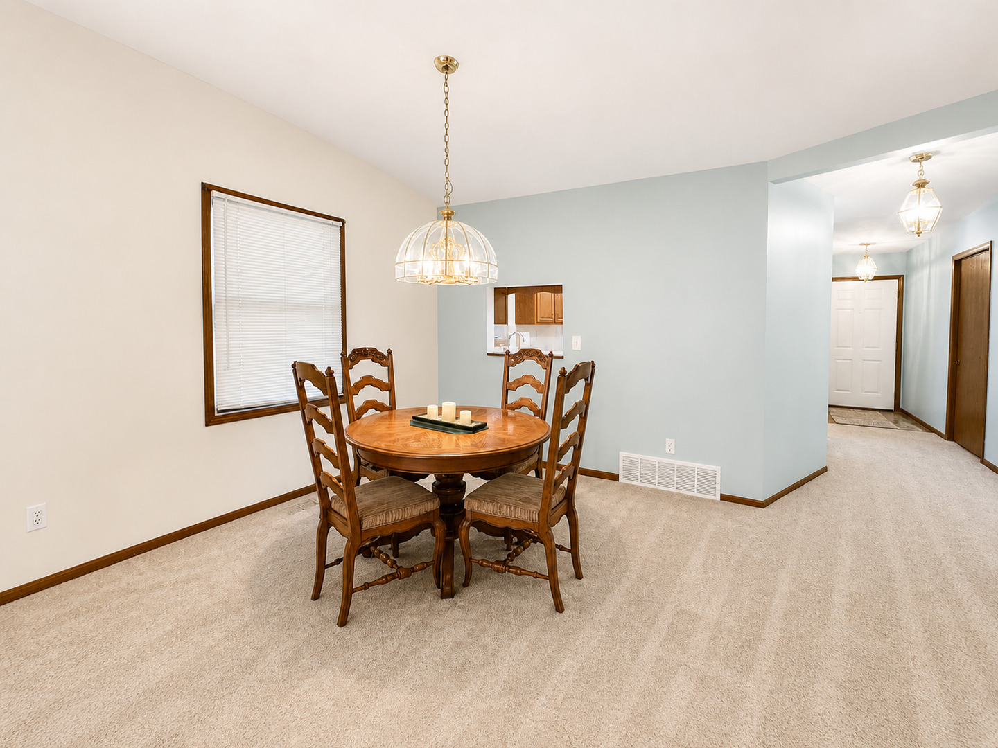 2608 38th Street Moline, IL 61265 - Photo 9 of 18 a view of a dining room with furniture and chandelier
