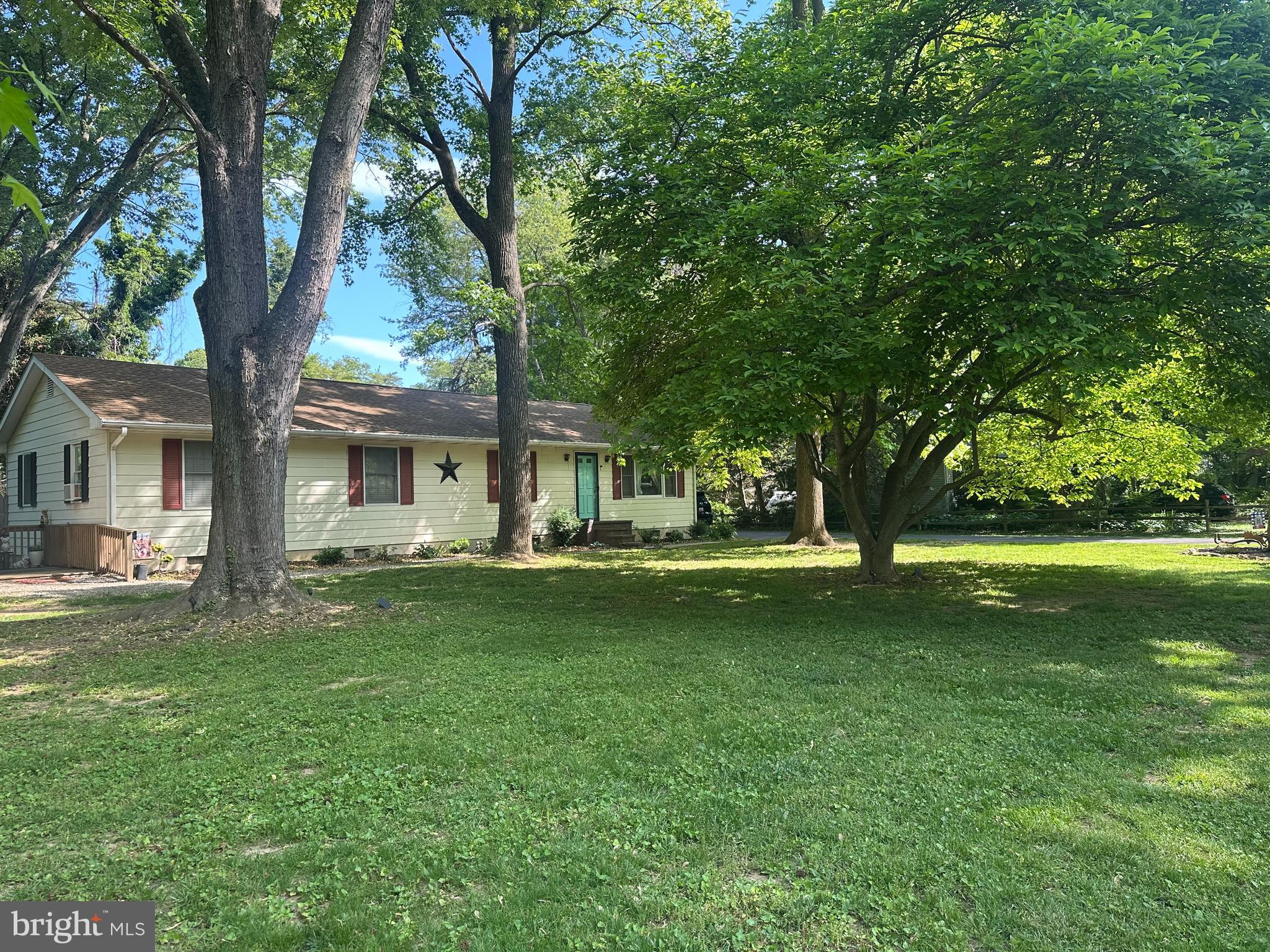 a view of a house with a big yard