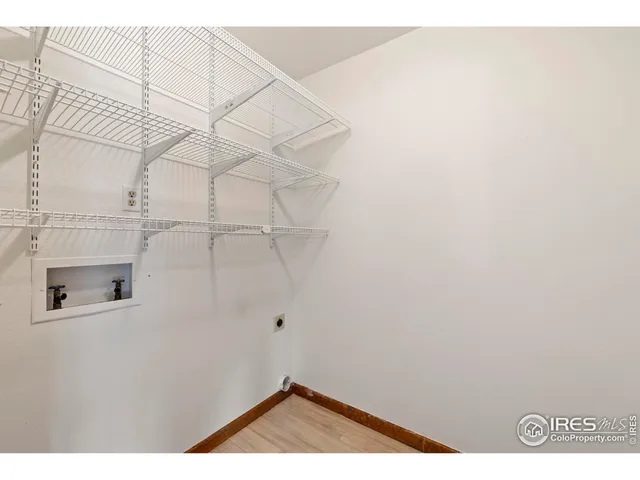 a view of a room with racks on the wall