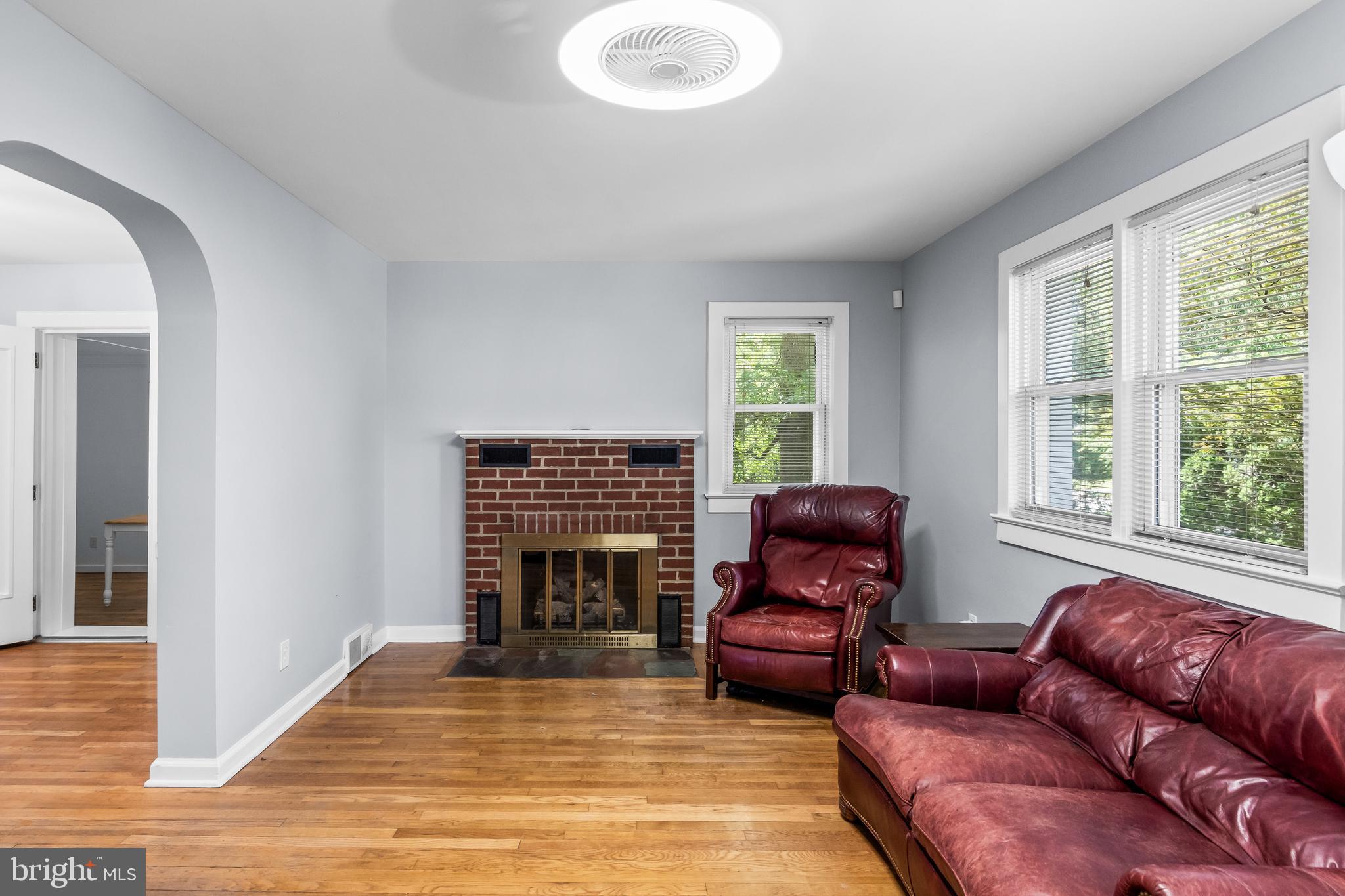 120 Lejune Road Cinnaminson, NJ 08077 - Photo 5 of 23 a living room with furniture windows and a fireplace