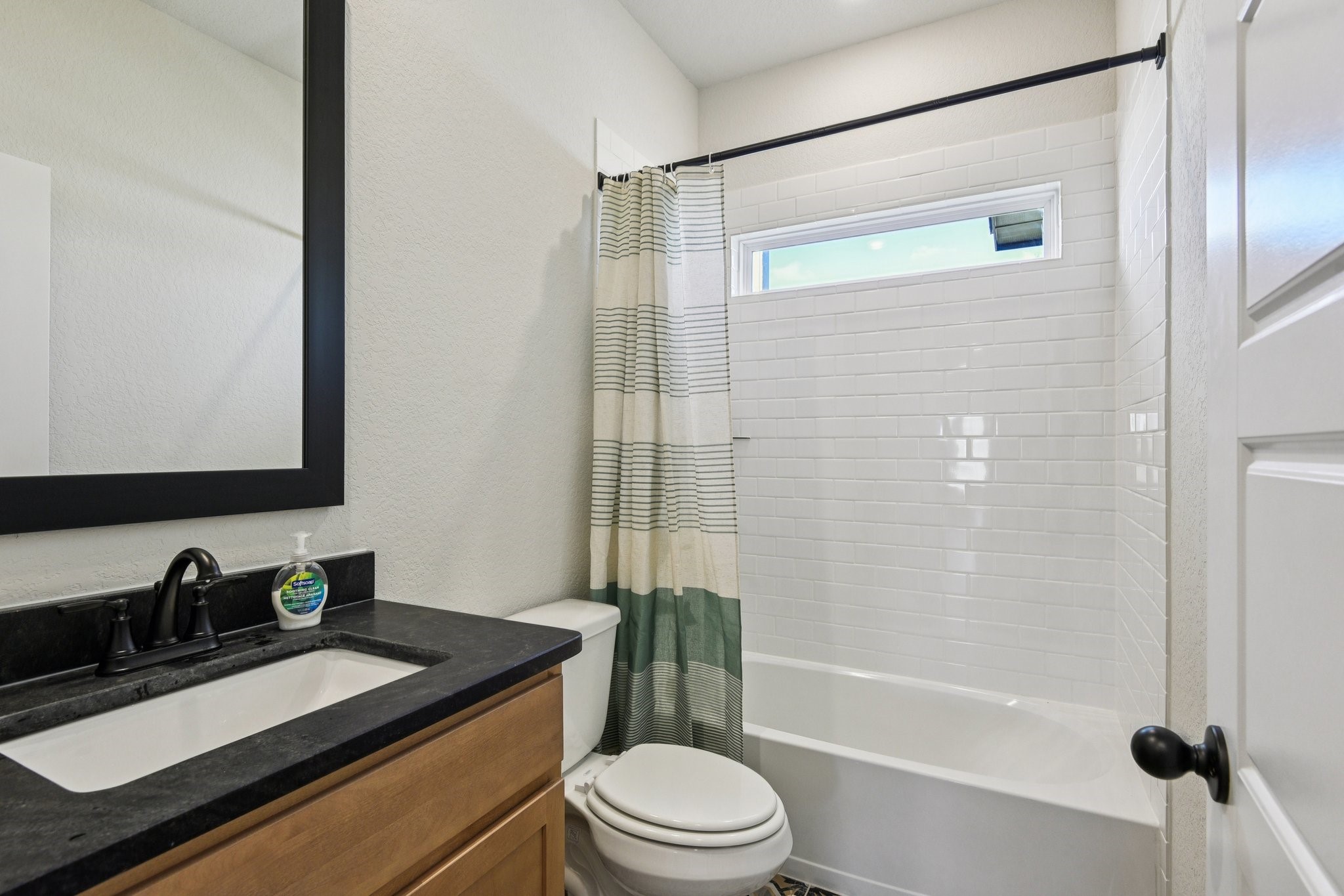 13629 Armstrong Street Conroe, TX 77303 - Photo 24 of 24 a bathroom with a granite countertop sink toilet and shower