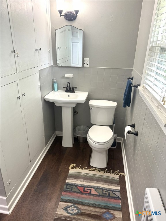 1045 Arnold Road Victoria, TX 77905 - Photo 11 of 15 a bathroom with a toilet sink and mirror