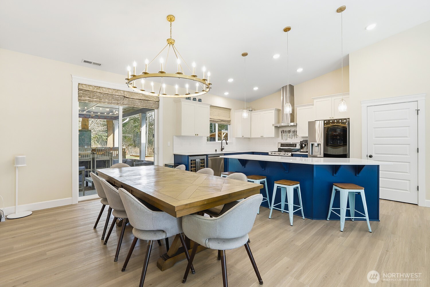 3237 Hilberg Lane Clinton, WA 98236 - Photo 11 of 40 a view of a dining room with furniture and wooden floor